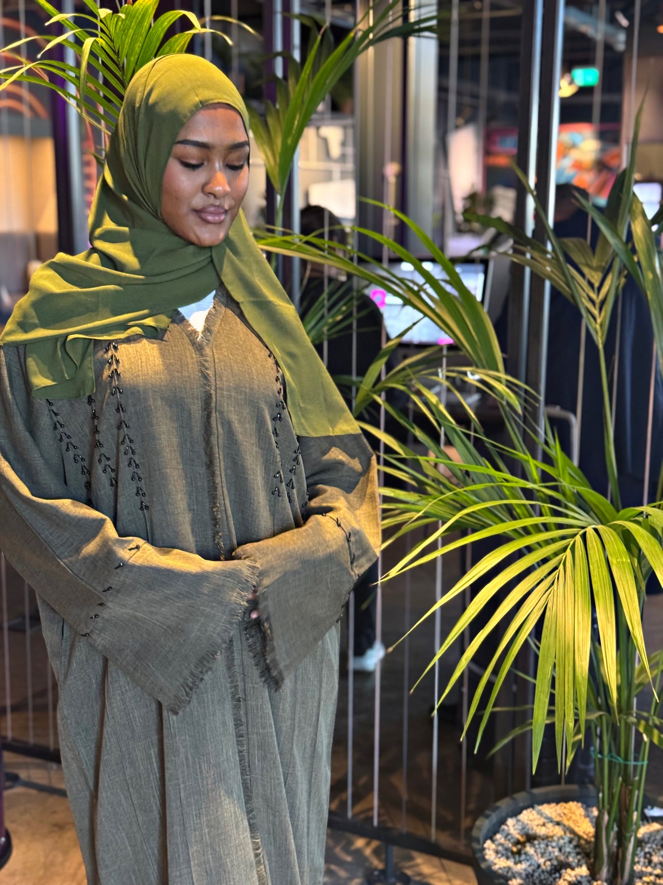 Olive Green Frayed Embellished Closed Abaya with Pockets and Hijab | AbayaTopia Olive Green Frayed Embellished Closed Abaya with Pockets and Hijab | AbayaTopia